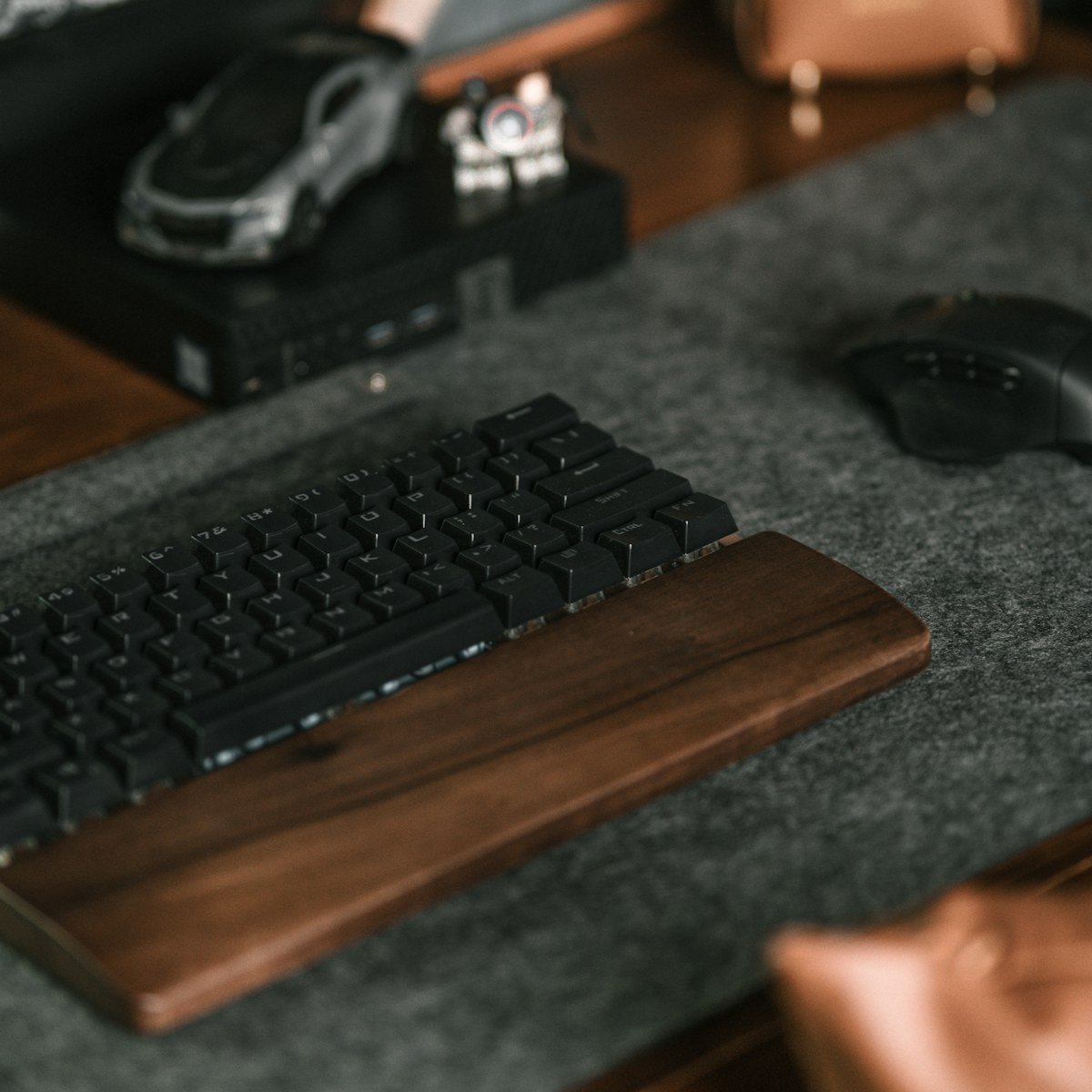 Compact felt desk mat under a keyboard