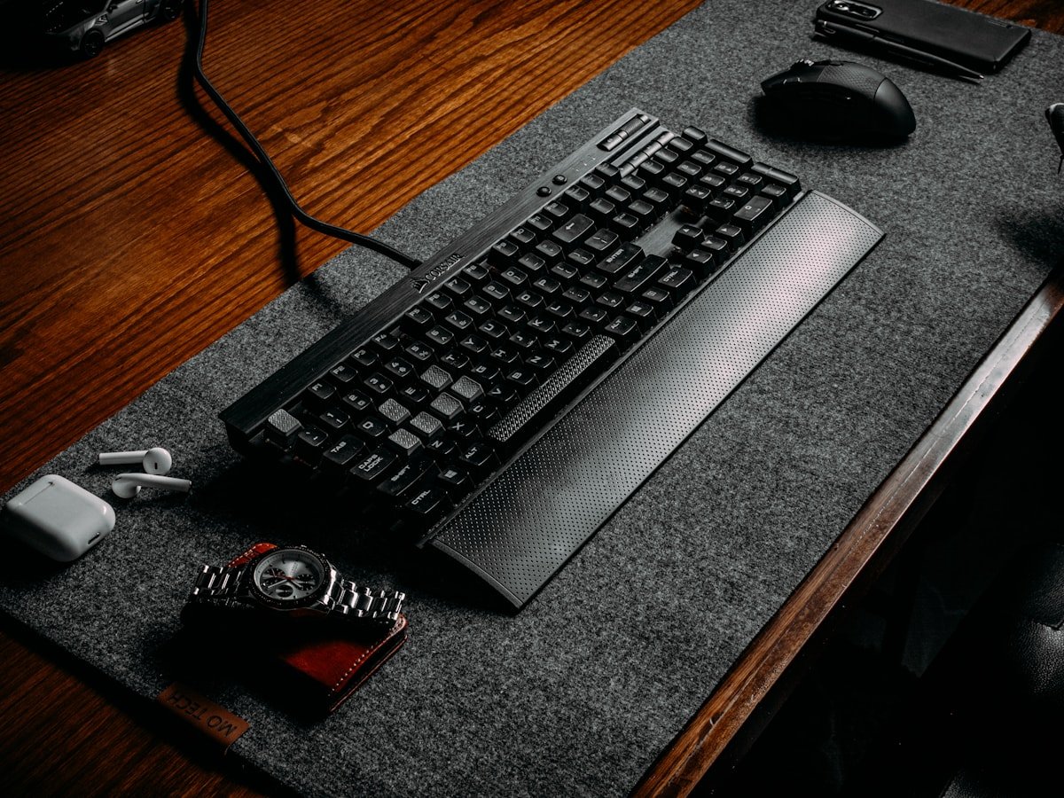 Wool felt desk mat with keyboard and mouse on a wooden desk