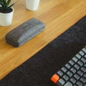 Memory foam keyboard wrist rest on a wooden desk